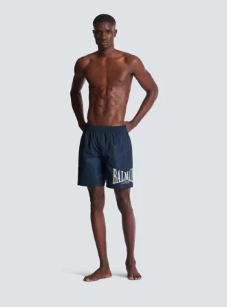 Badshorts med Balmain College-logotyp