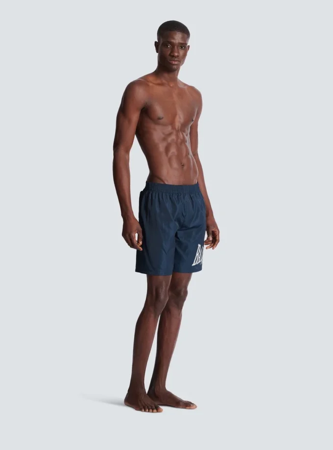 Badshorts med Balmain College-logotyp
