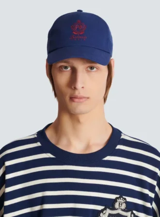 Bomullskeps med collegeemblem