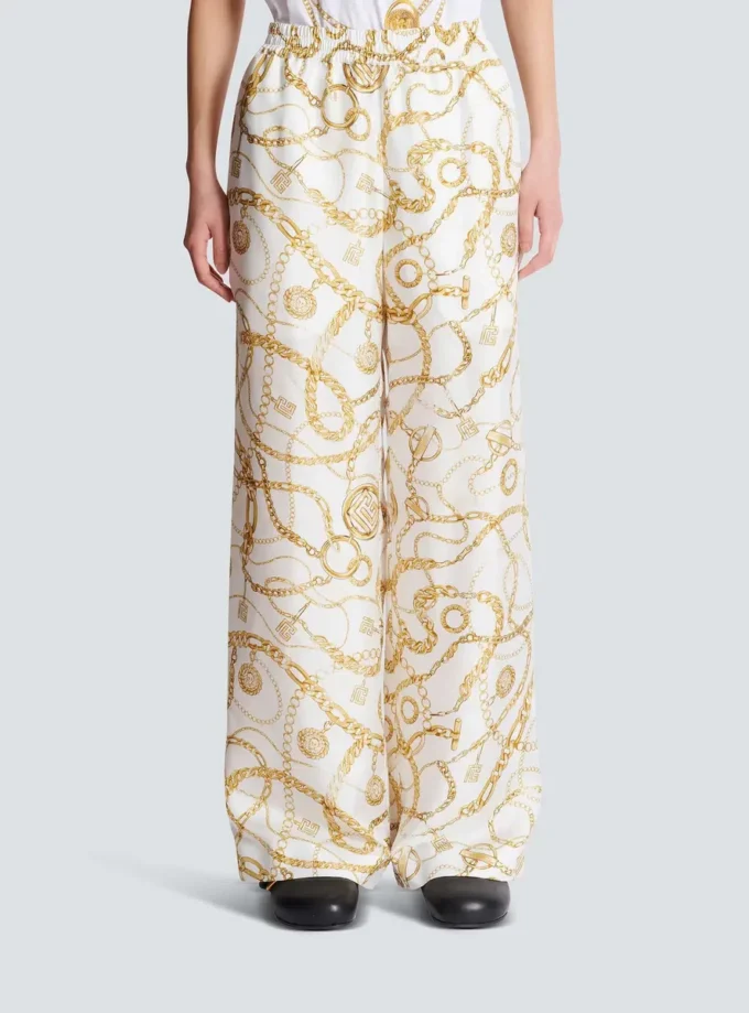 Flödande byxor i tryckt siden med Balmain Chains-mönster Flödande byxor i tryckt siden med Balmain Chains-mönster