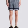 Flödande shorts med monogram