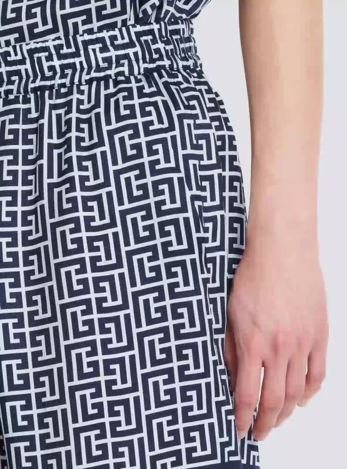 Flödande shorts med monogram