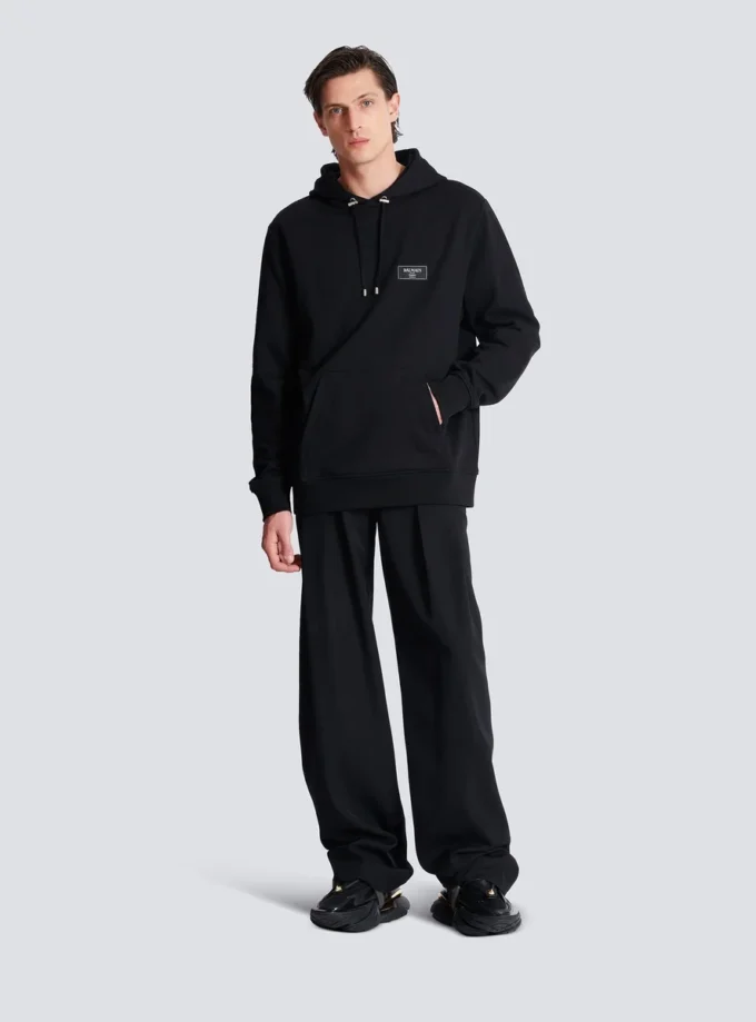 Huvtröja med Balmain Couture-etikett