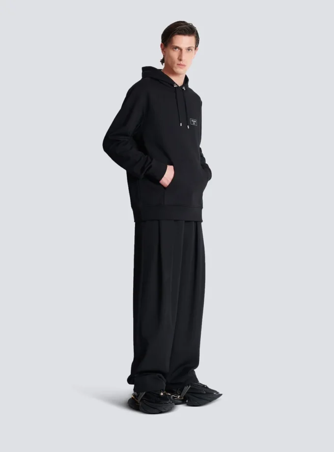 Huvtröja med Balmain Couture-etikett