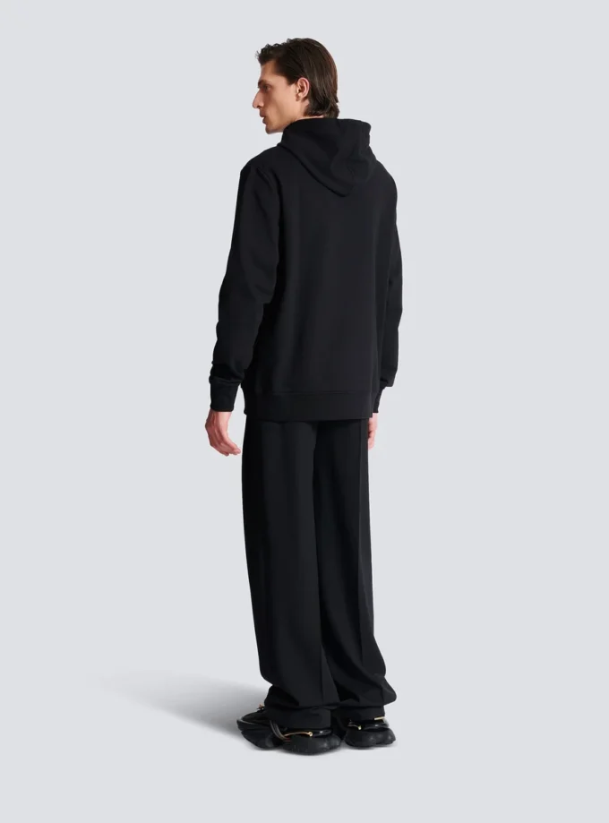 Huvtröja med Balmain Couture-etikett
