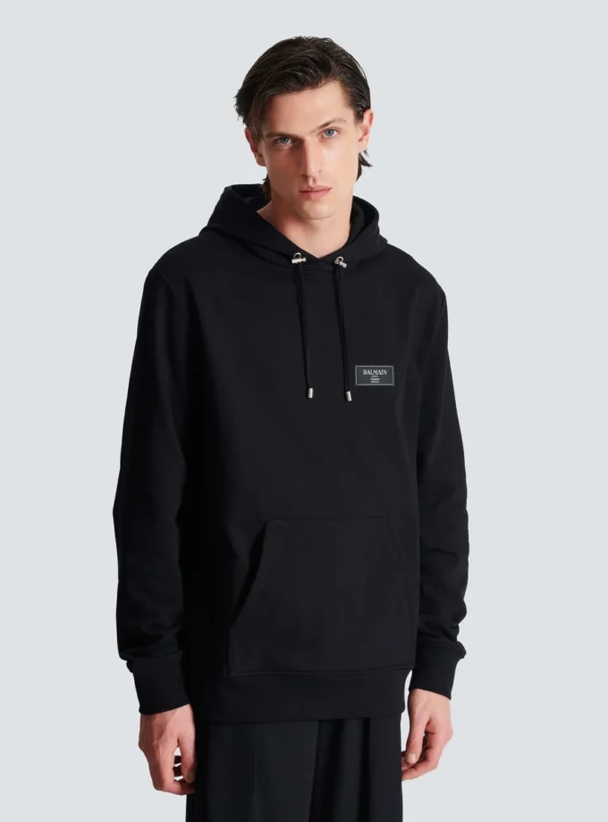 Huvtröja med Balmain Couture-etikett