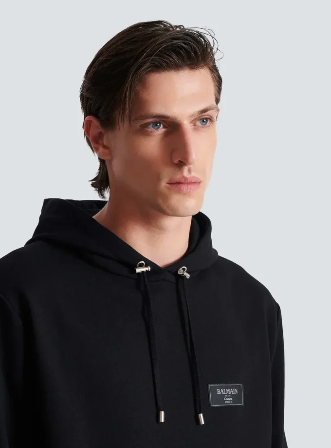 Huvtröja med Balmain Couture-etikett