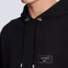 Huvtröja med Balmain Couture-etikett