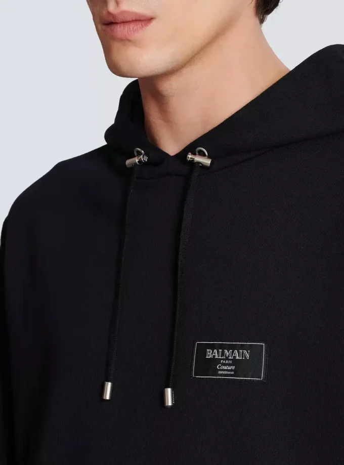 Huvtröja med Balmain Couture-etikett