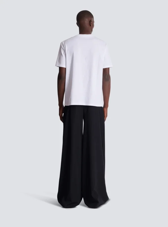 Kortärmad T-shirt med flockat Balmain College-tryck