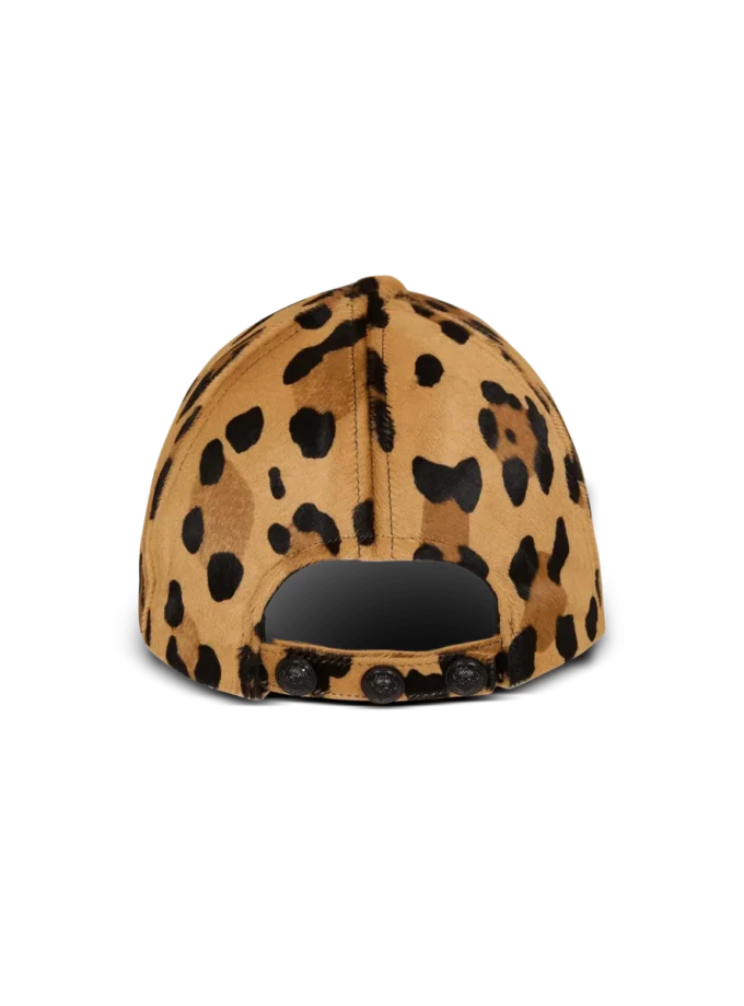 Läderkeps i ponnyhudstil med leopardmönster