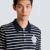 Randig polo med collegeemblem Randig polo med collegeemblem