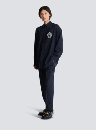 Randig ullskjorta med collegeemblem