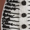 Tweedkjol med broderade kärleksbrev Tweedkjol med broderade kärleksbrev
